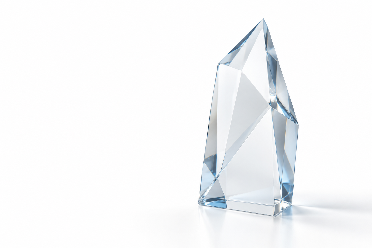An angular transparent glass prism with subtle blue facets